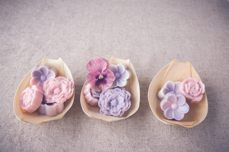 Pastel pink purple flower coconut jelly on bamboo serving boat,vintage toningの写真素材