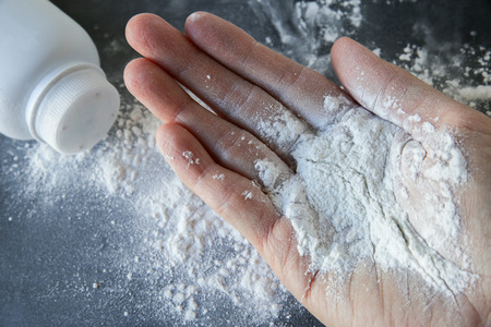 Talcum powder on handsの写真素材