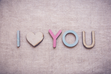 I love you made from wooden letters and heart shape wood, Valentines toning backgroundの写真素材