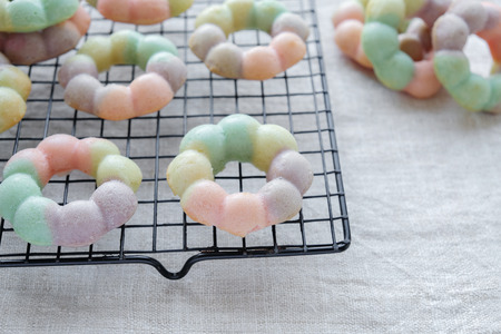 homemade rainbow donutsの写真素材