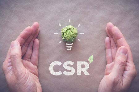 Green paper light bulb with CSR, Corporate social responsibilityの写真素材