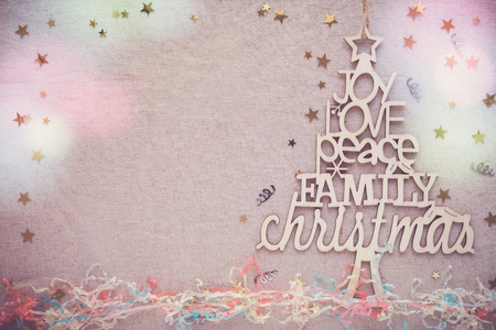 Christmas tree with love joy peace words, holidays copy space retro backgroundの写真素材