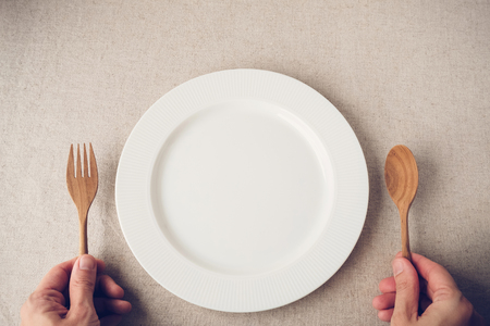 white plate with spoon and fork, Intermittent fasting concept, ketogenic diet, weight loss, dietの写真素材