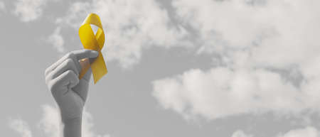 Hands holding yellow gold ribbon over sky, Sarcoma Awareness, Bone cancer, childhood cancer...