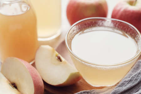 Apple cider vinegar with mother in glass bowl, probiotics food for gut health