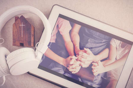 Children praying with father parent with  digital tablet, family and kids worship online together at...