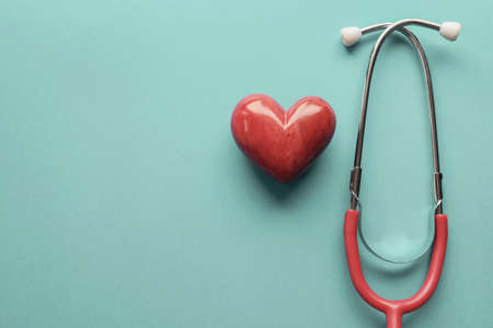 Red heart with stethoscope, heart health,  health insurance concept, World heart day, world health dayの写真素材