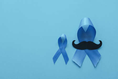 Light blue ribbons with mustache on blue backgroundの写真素材