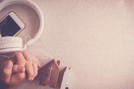 home church , praying hands with digital device for online internet worship, social distancing, isolation, new normal conceptの写真素材