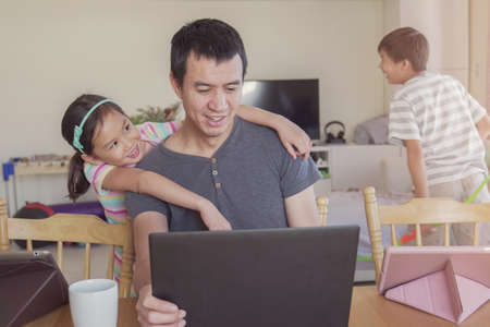 Father working from home with children. Homeschooling, stay home, social distancing during...