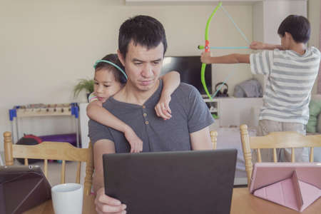 Father working from home with children. Homeschooling, stay home, social distancing during coronavirus quarantine isolation, freelance job conceptの写真素材