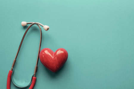 Red heart with stethoscope, heart health,  health insurance concept, World heart day, world health...