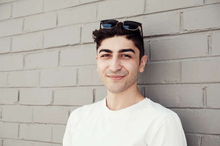 Happy multicultural young adult man portraitの写真素材