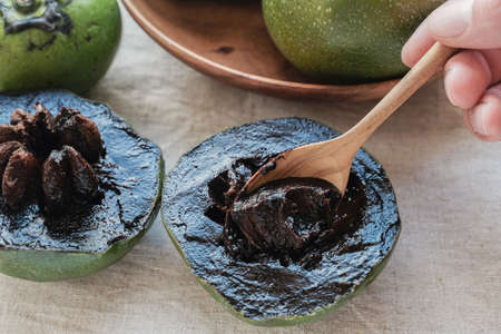 Black sapote chocolate pudding fruit , plant based vegan foodの写真素材
