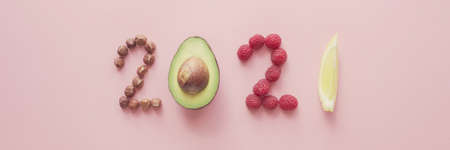 2021 made from healthy food on pink background, Happy New year, health diet resolution, goals and lifestyleの写真素材