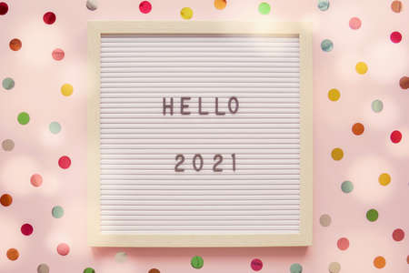 HELLO 2021 on letter board with colorful dot pink pastel background, Happy New Yearの写真素材