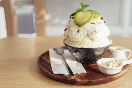 Healthy bingsu shaved ice dessert with almond and avocado topping, ketogenic low carb vegan plant-based dessertの写真素材