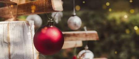 Christmas decoration bauble ball on eco reusable rustic tree, festive backgroundの写真素材