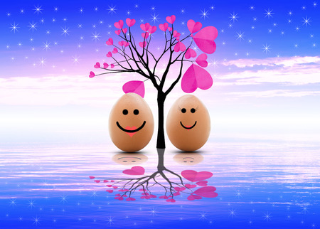 happy eggs boy and girl with love under the tree of love.の写真素材