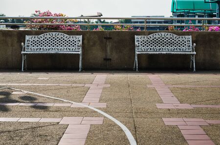 two bench on cement floor.