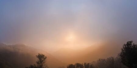panorama of mountain with misty in golden hour on morning.