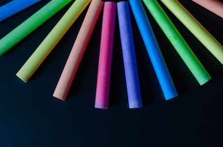 colorful color chalk variety on blackboard.