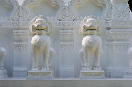 two white lion statue in thailand temple.の写真素材