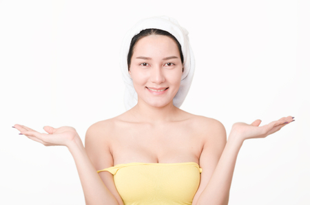 beauty portrait attractive asian woman smile with towel over head against white background.の写真素材