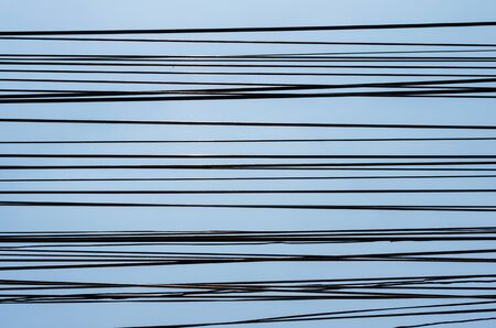 pattern of electric cable or wires texture stacking against blue sky background.の写真素材