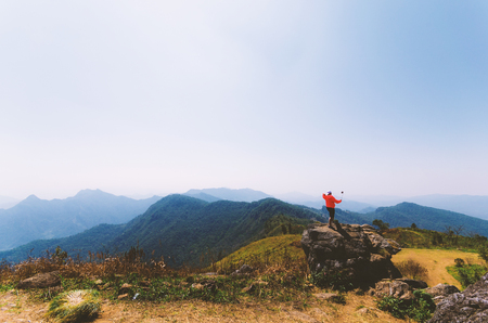 people selfie on the rock on mountain nature landscape with blue sky.の写真素材