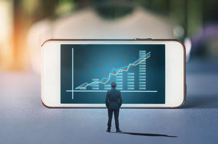 business man investor broker look stock forex index information analysis trading graph investment chart on big mobile screen digital data technology display online.の写真素材