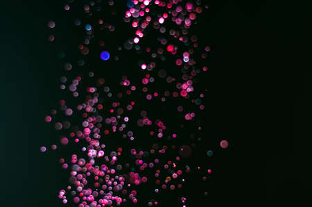 abstract bright colorful violet and red bokeh glitter sparkle blurred background. like molecule spread and absorb.の写真素材