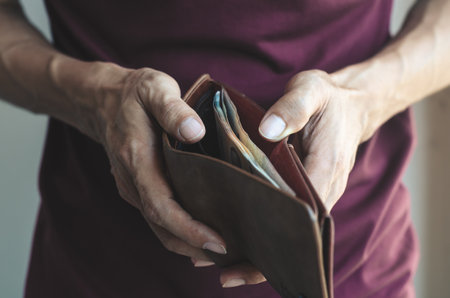 hipster man open show leather wallet with holding and take and pick money saving. wealth financial rich payment concept.の写真素材