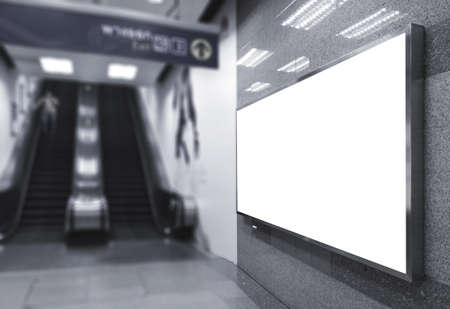 blank billboard white screen LED horizontal advertising banner board indoor in subway station ad interior public hall side escalator interior underground.の写真素材