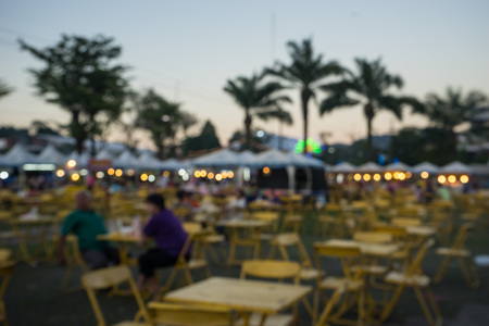 table chair and food shop in  fair on urban of  Thailand such as Loy Kra Thong festival occurred 10 days in  twelfth lunar month, new year festival , anniversary established,blurred backgroundの写真素材