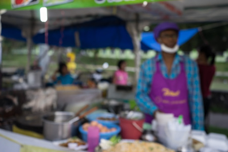 merchant and food shop in  fair on urban of  Thailand such as Loy Kra Thong festival occurred 10 days in  twelfth lunar month, new year festival , anniversary established,blurred backgroundの写真素材