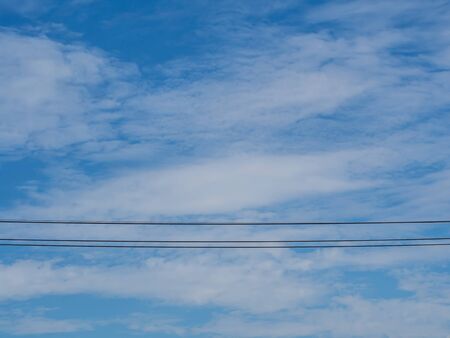 blue sky with three cableの写真素材