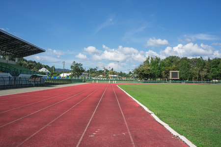 grandstand, race track , football field with blue sky