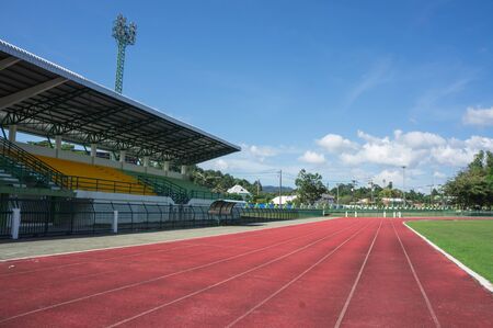 grandstand, race track , football field with blue skyの写真素材