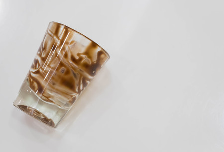 hot fudge stripe on glass , white background ,top viewの写真素材