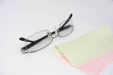 shade adjustable eyeglasses  and pale color clean clothの写真素材