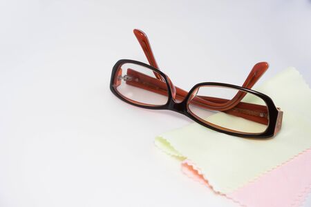 adjustable eyeglasses and pale color clean clothの写真素材