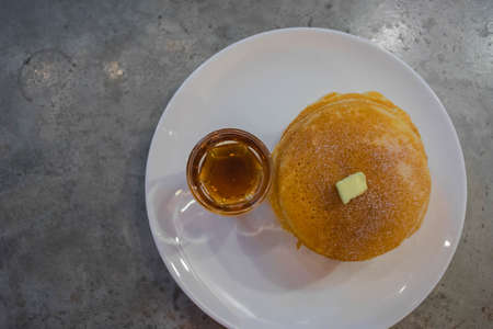pancake with maple syrup, top view, cement backgroundの写真素材