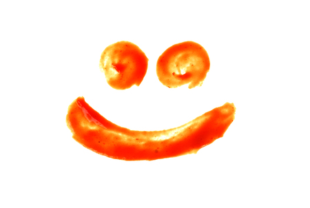 Fresh red ketchup stains Pile up on a white background.の写真素材