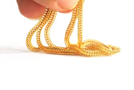 Gold neck weighs about 0.5 grams on white background.