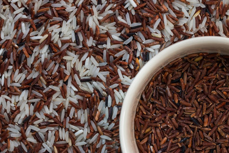 Brown rice in the cup on mix rices : white (jasmine) rice,riceberry and brown riceの写真素材