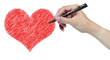 hand with pen draw heartの写真素材