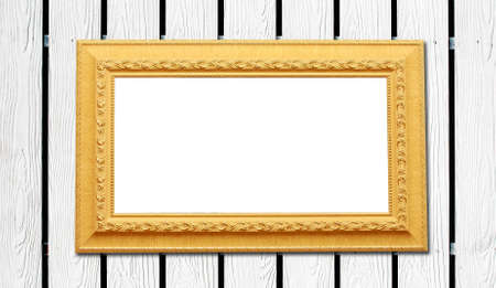 THe white wood fence background with yellow photo frameの写真素材