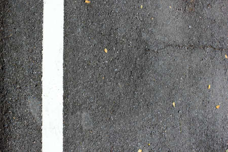 The asphalt road texture with white lineの写真素材