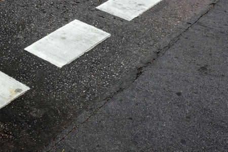 The asphalt road texture with white stripe painted on roadの写真素材